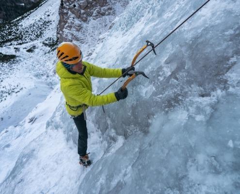 Ice climbing on top rope in Julian Alps