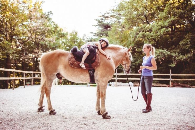 Little Girl Taking Horse Riding Lessons in Slovenia