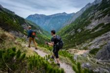 Guys hiking in Kamnik Savinja Alps Mountains