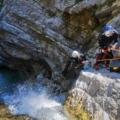 The guide is lowering the client down to the next pool
